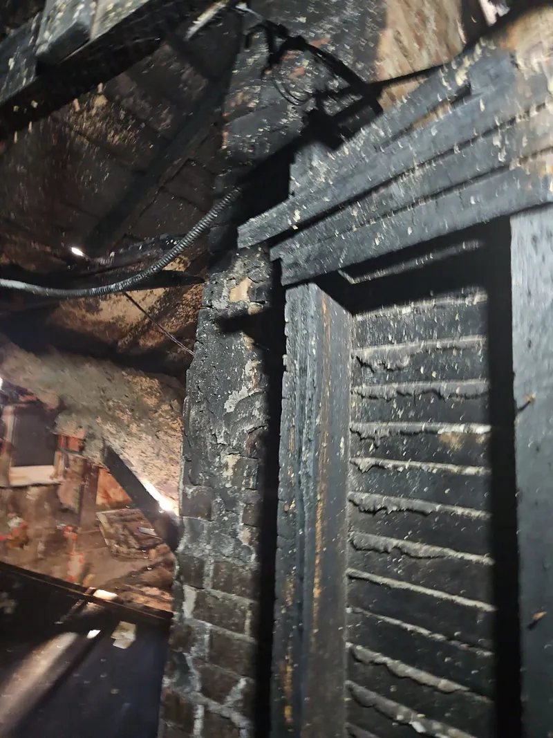 Fire and smoke spread through interior walls and doorways.