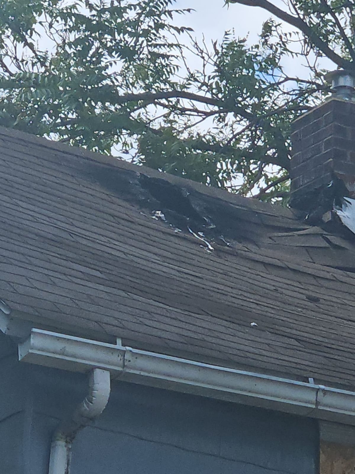 Exterior roofline and gable damage.