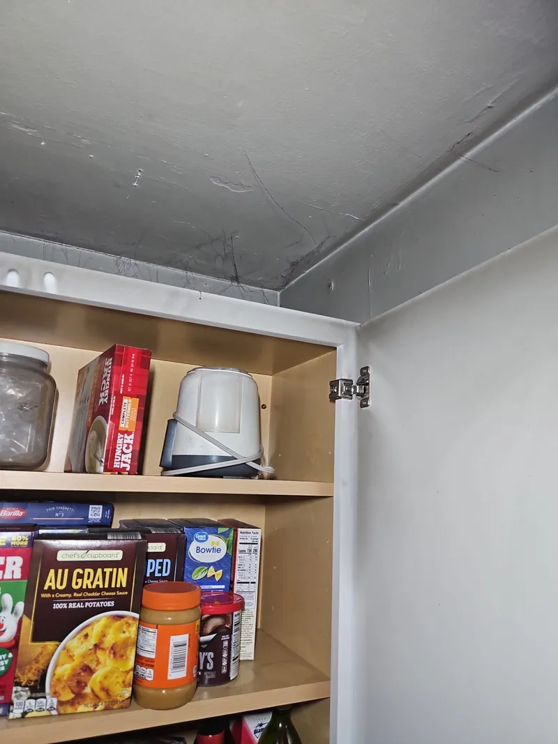 Soot settles on everything — inside the cabinets and onto the contents, not just the surfaces you can see.