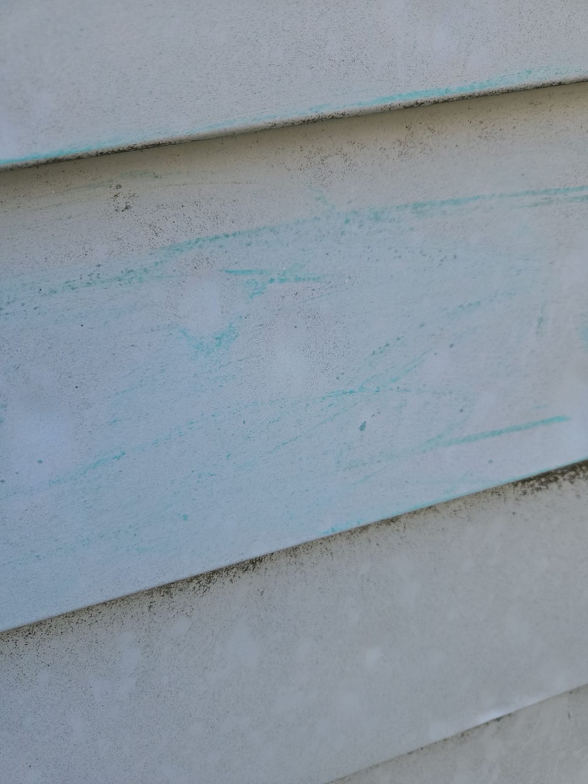 The same chalk technique on another elevation reveals a field of hail strikes the naked eye misses.