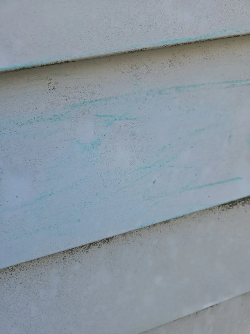 The same chalk technique on another elevation reveals a field of hail strikes the naked eye misses.