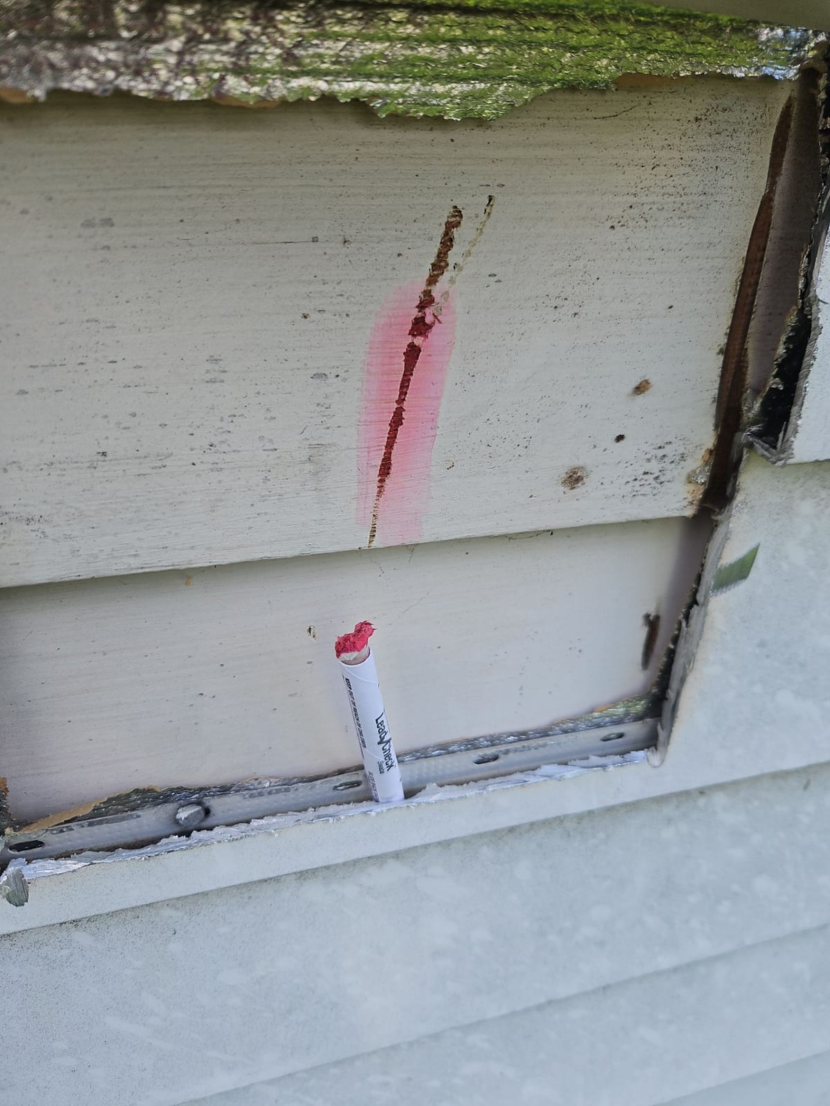 Testing for lead-based paint (a positive swab shown). Older Ohio homes trigger safe-handling and code requirements that add to the true repair cost.