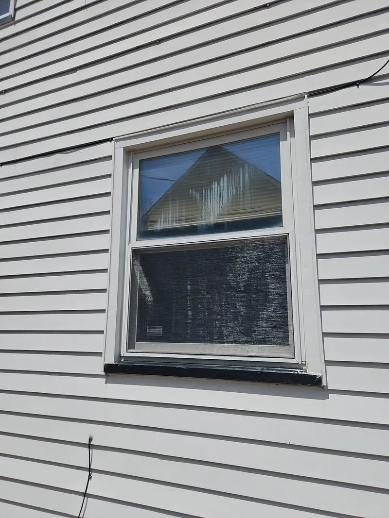 Impacts around the windows and trim — hail damage is rarely limited to the roof.
