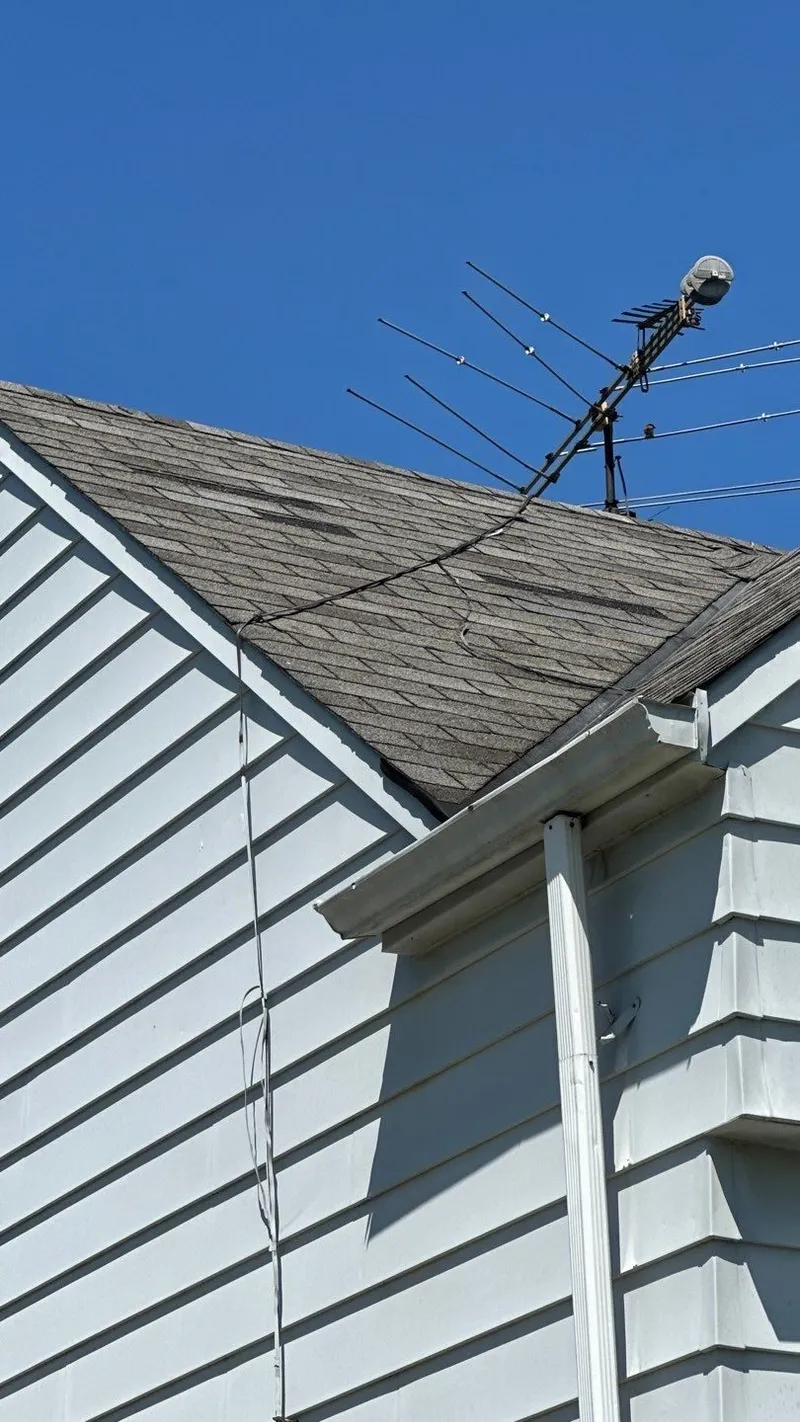The roof, gutter and rake documented together — the shingle field and its metals inspected as one system.