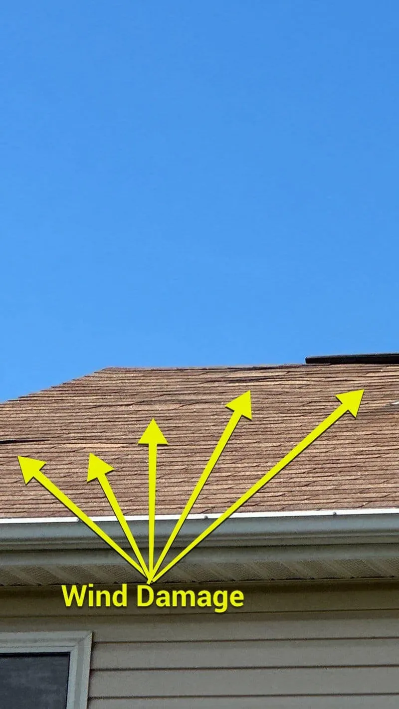 More marked wind damage on the rear roof — the pattern across slopes proves a storm loss.