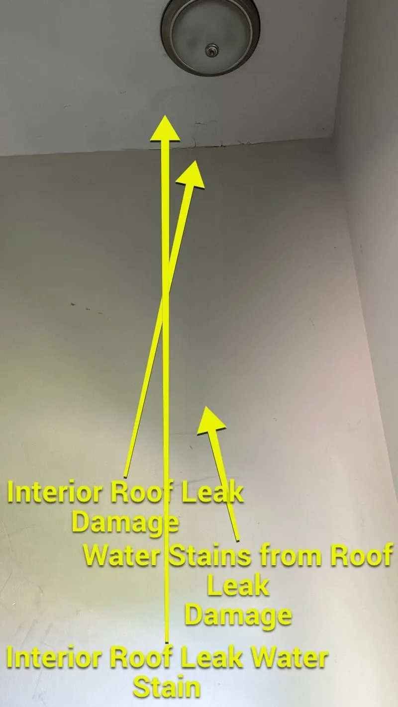 More marked water staining tracking down from the ceiling line.