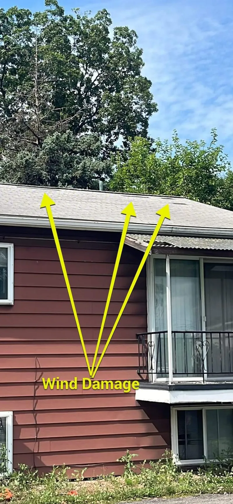 More marked wind damage along the roofline — the lifted shingles insurers try to write off as “old” instead of storm-caused.