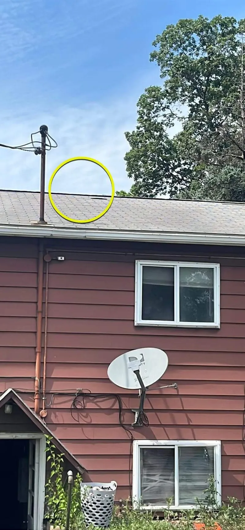 Circled roof damage above the units — every affected section is documented on-site.